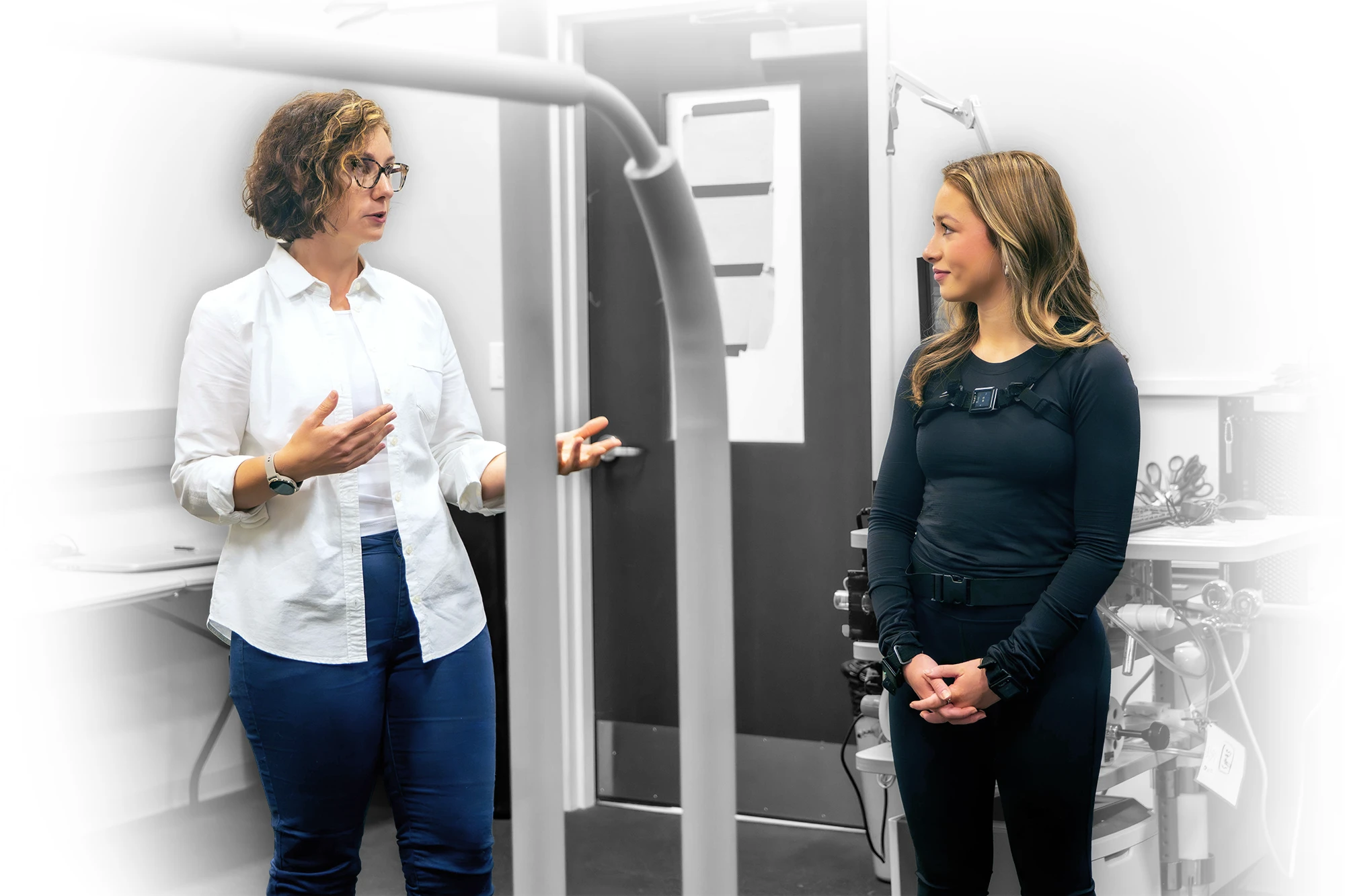 Jaimie Roper speaks with Eva Litkenhous in Auburn’s Locomotor Lab during a Parkinson’s disease research visit.
